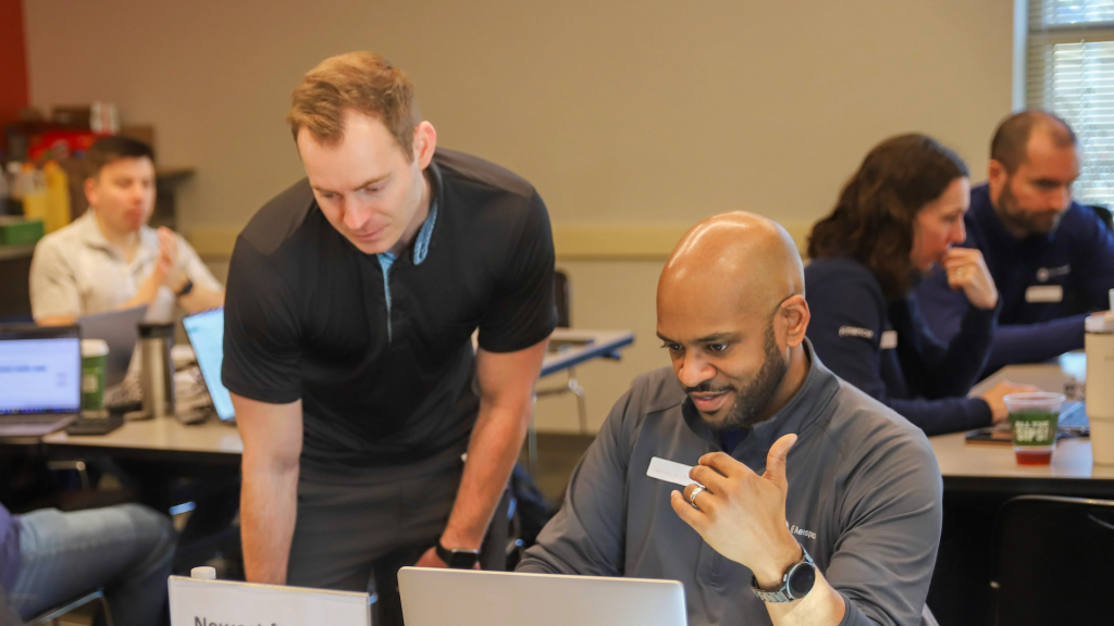Volunteers from GE prepare taxes for community members at the Reading Branch Library