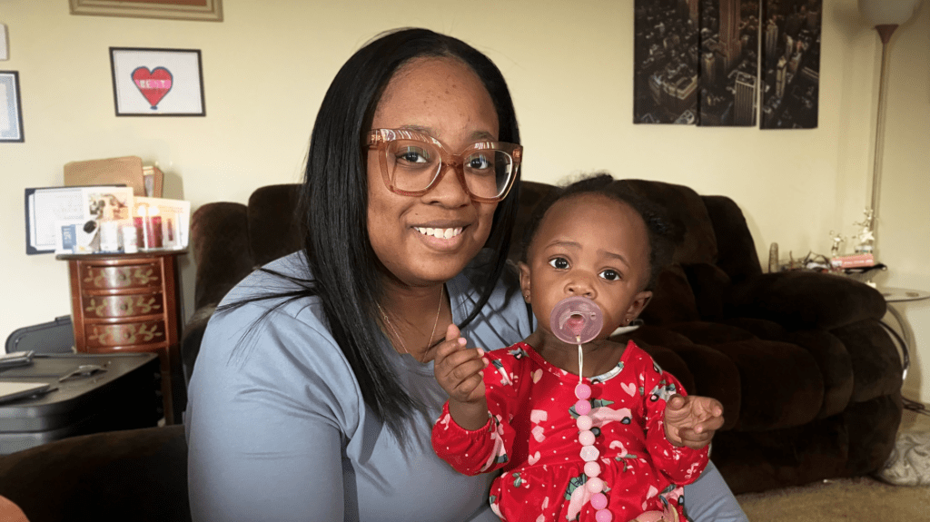 A Project LIFT participant with her child.