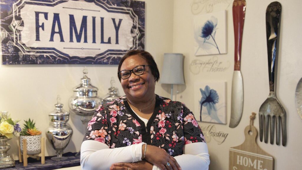 A Project LIFT participant smiling.