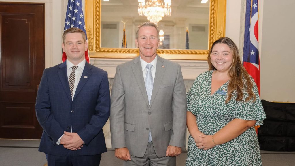 Various United Way staff with Jon Husted